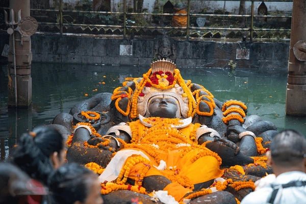 statue-sleeping-vishnu-covered-flowers-600nw-2187657667